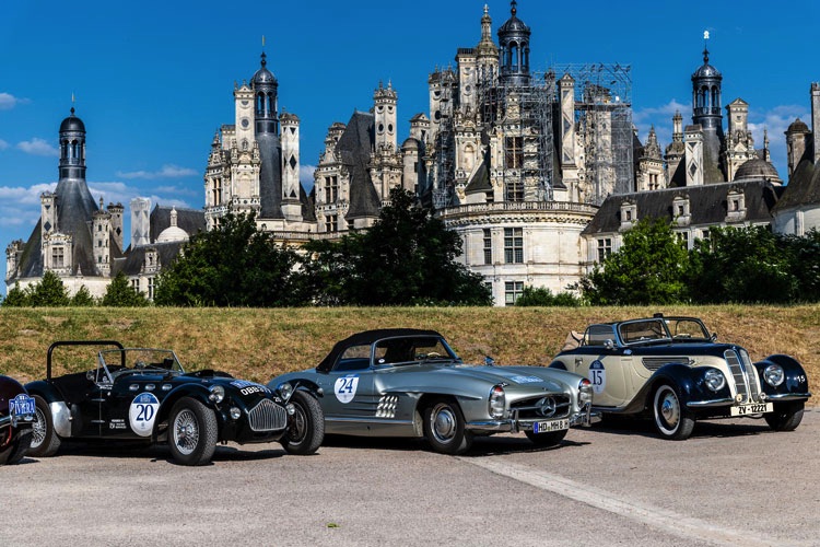 Allard J2 (#20), Mercedes-Benz 300SL (#24), and BMW327/80 lined up in front of iconic Loire Chateau