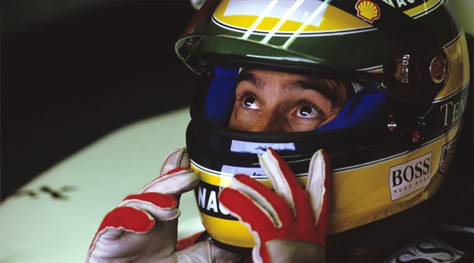Ayrton Senna sitting in McLaren racing car at Silverstone 