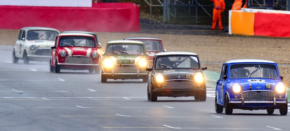 Minis racing at Silverstone circuit, GB